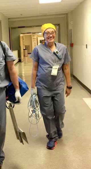 Jan Pasnak wearing scrubs