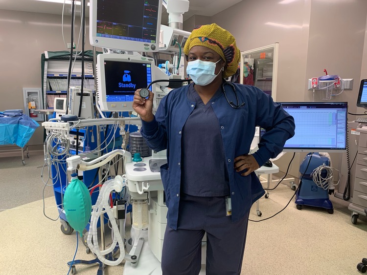 Amber Coleman standing in front of anesthesia equipment